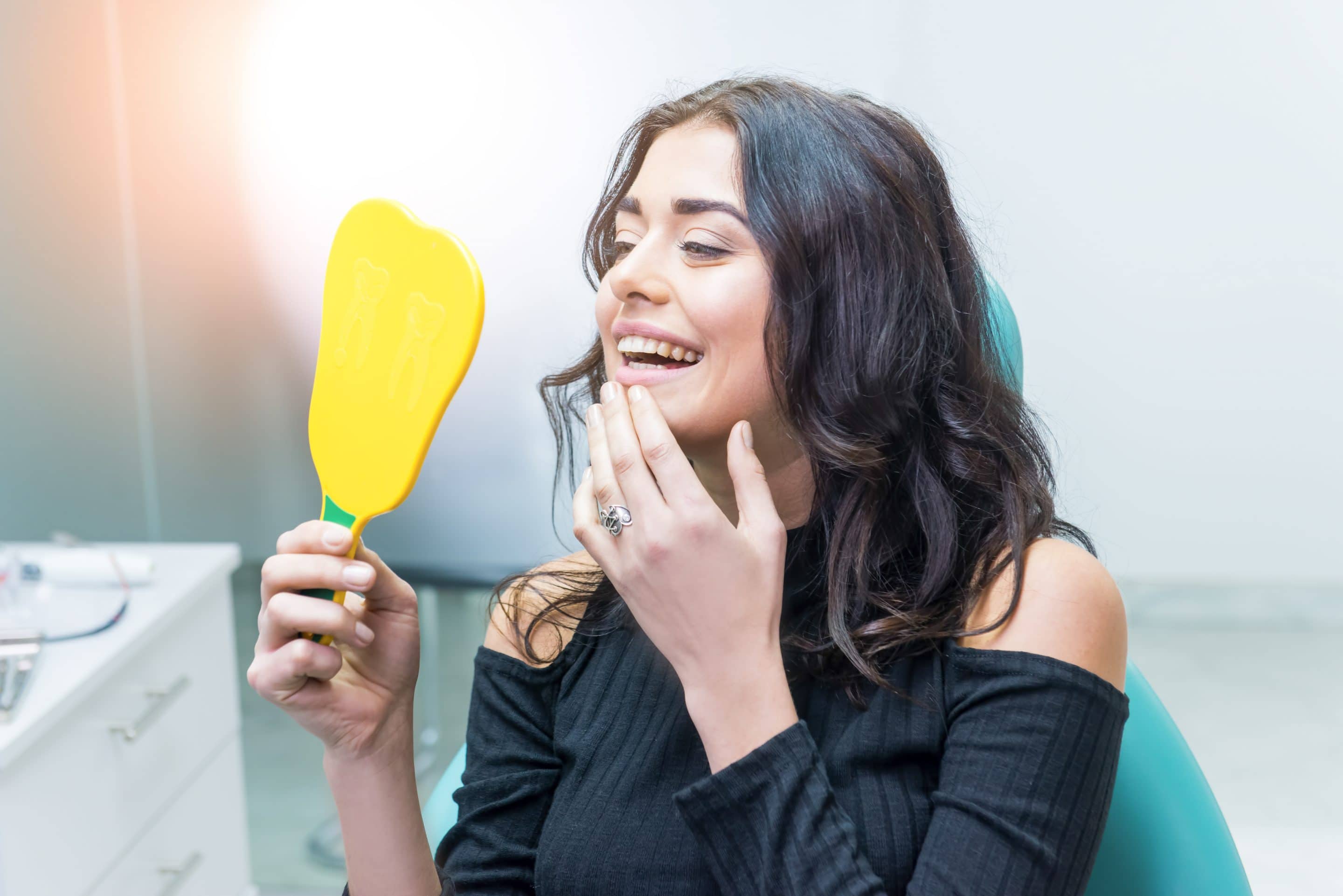 Woman looking at her teeth, Periodontal Cleaning